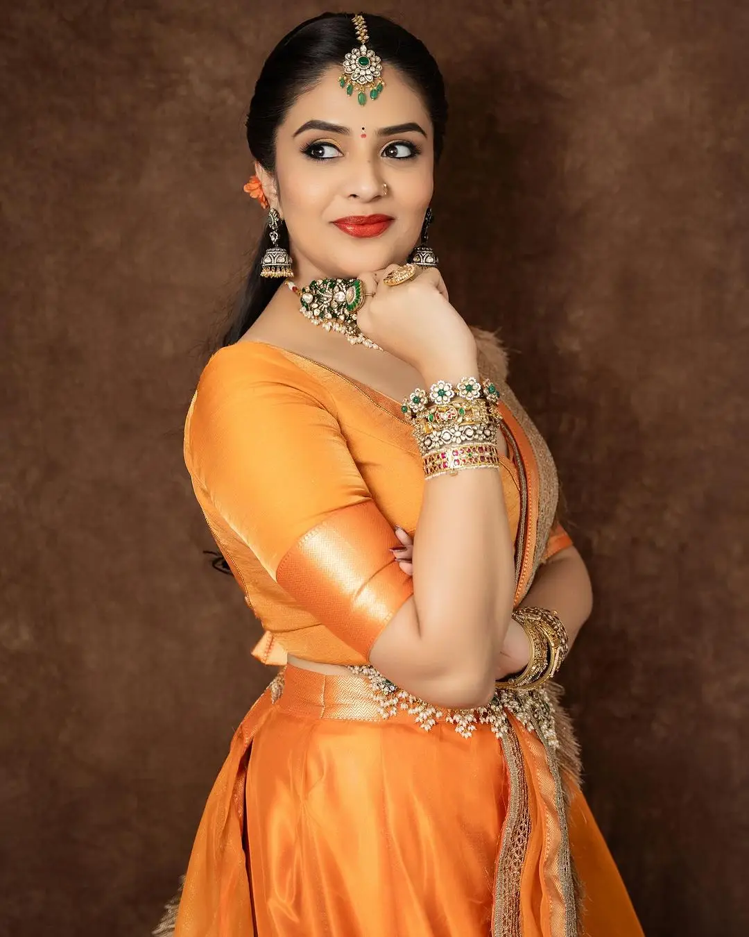 ETV Actress Sreemukhi in Orange Lehenga Blue Choli